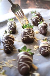 adding white chocolate with a fork
