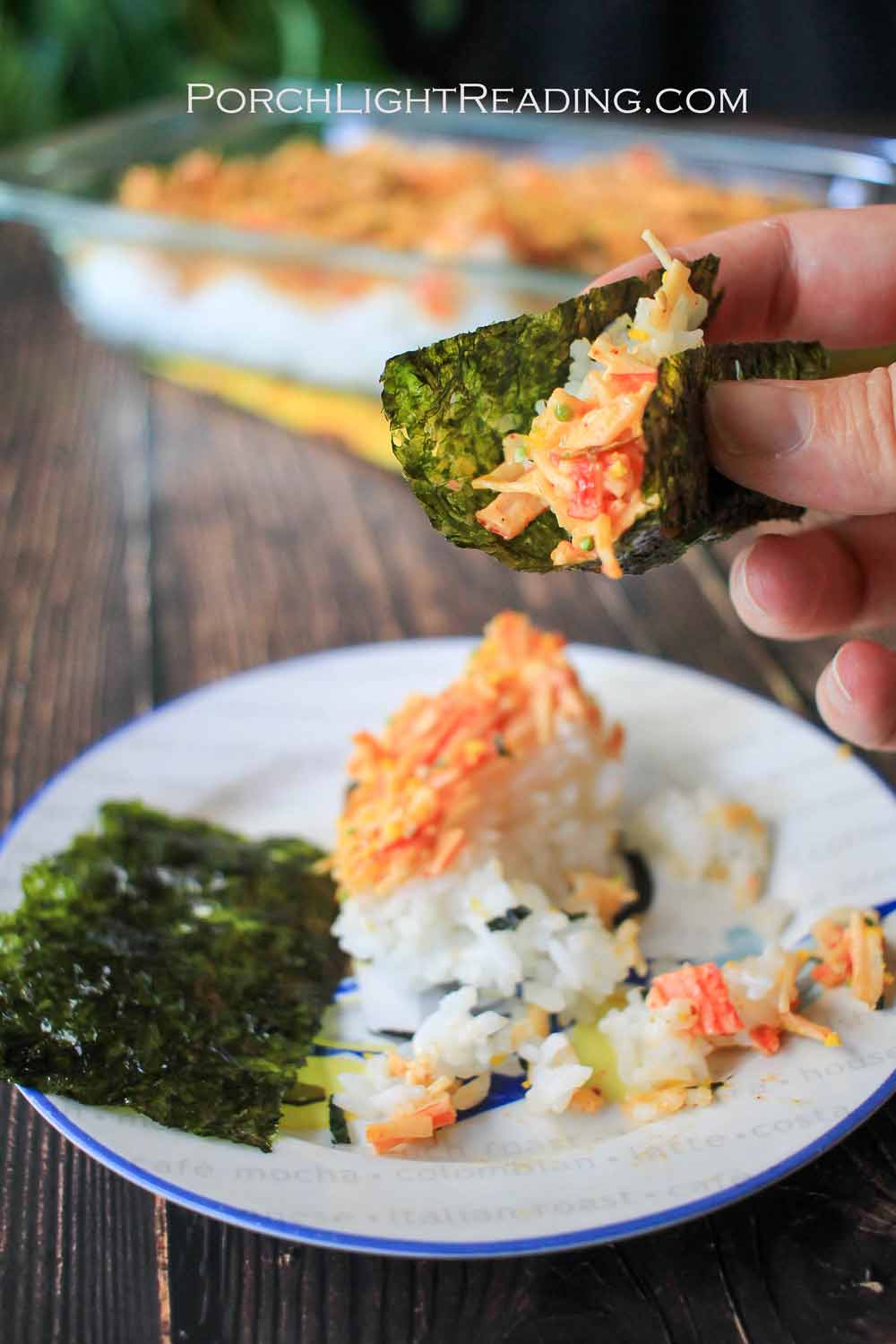 Homemade sushi bake wrapped in a seaweed bite.