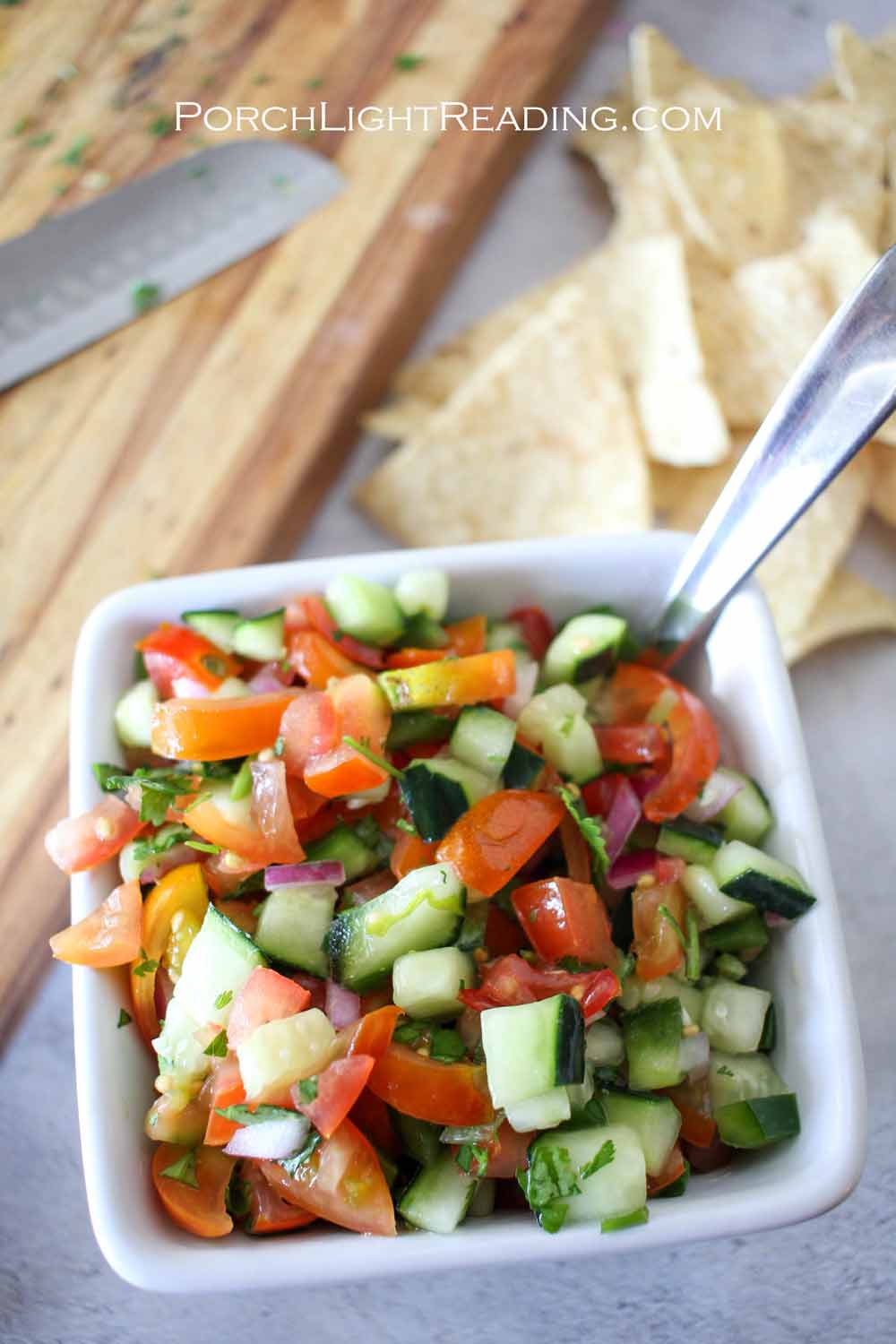 Cucumber salad with vibrant, fresh, vegetables.