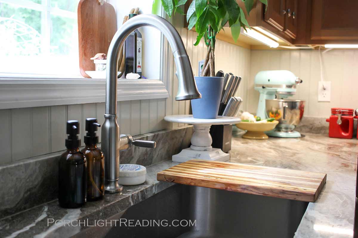 Beadboard backsplash behind kitchen sink.