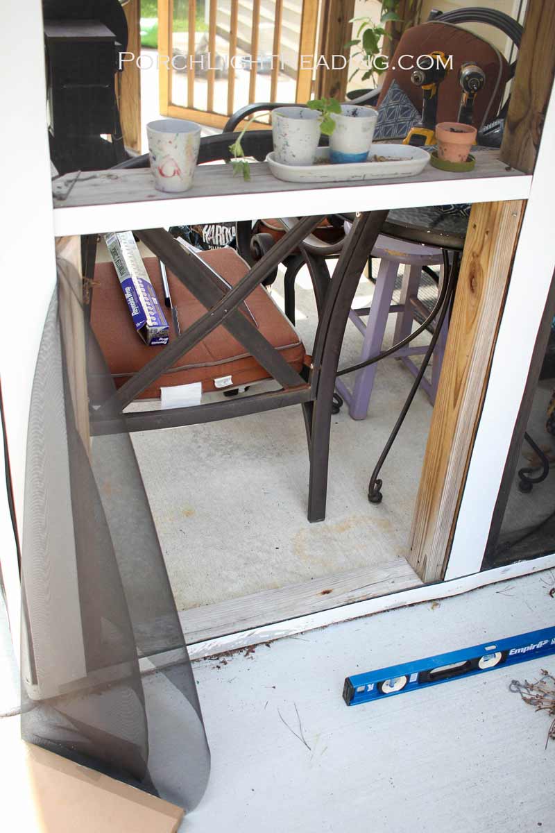 Broken screen from dog using it as a door.