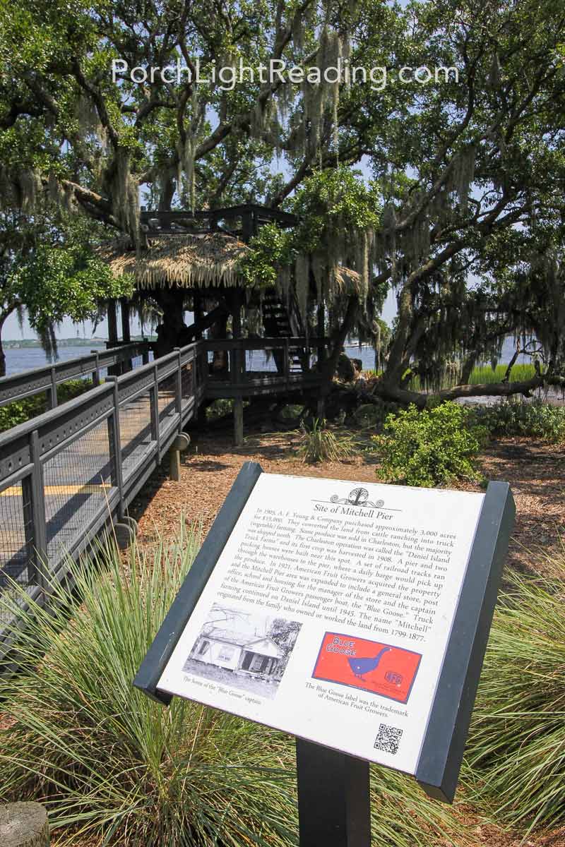 Informational plaque in front of treehouse.