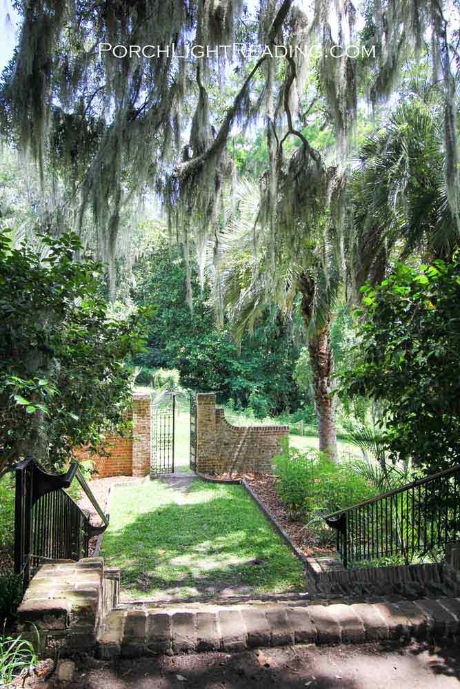 Hidden gate at surrounded by greenery.