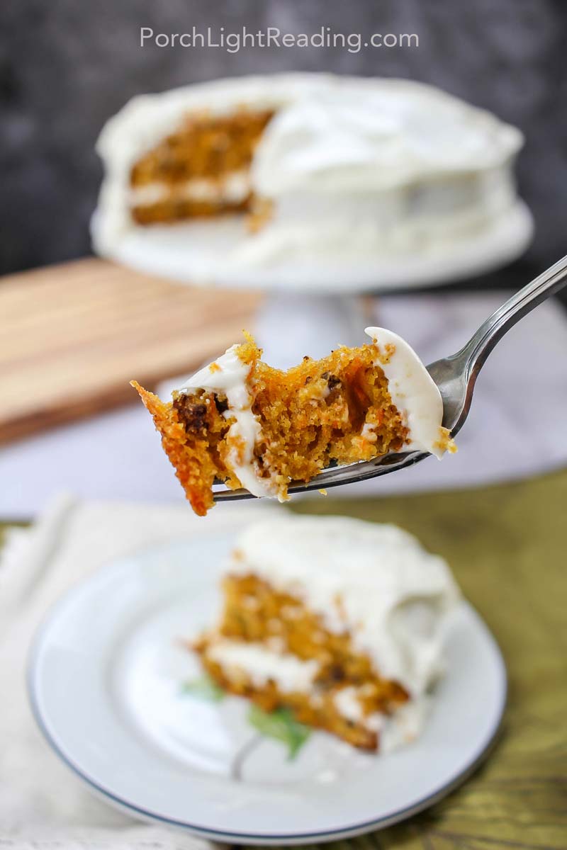 Moist carrot cake on silver fork.