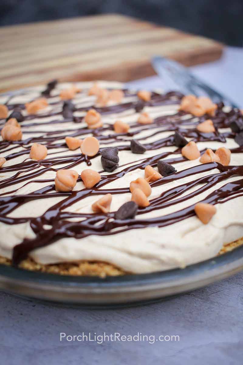 Chocolate drizzle on top of light and creamy pumpkin cheesecake. 