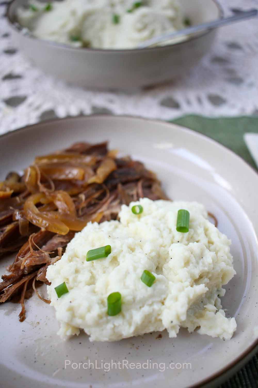 Cauliflower mashed potatoes topped with chives.