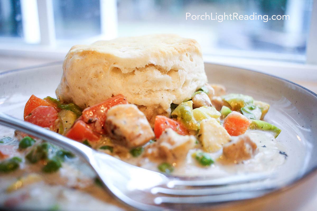 Homemade chicken pot pie with creamy filling and golden biscuit crust. A simple recipe made with everyday ingredients.