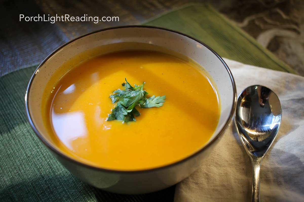 Bowl of butternut squash soup lightly garnished.
