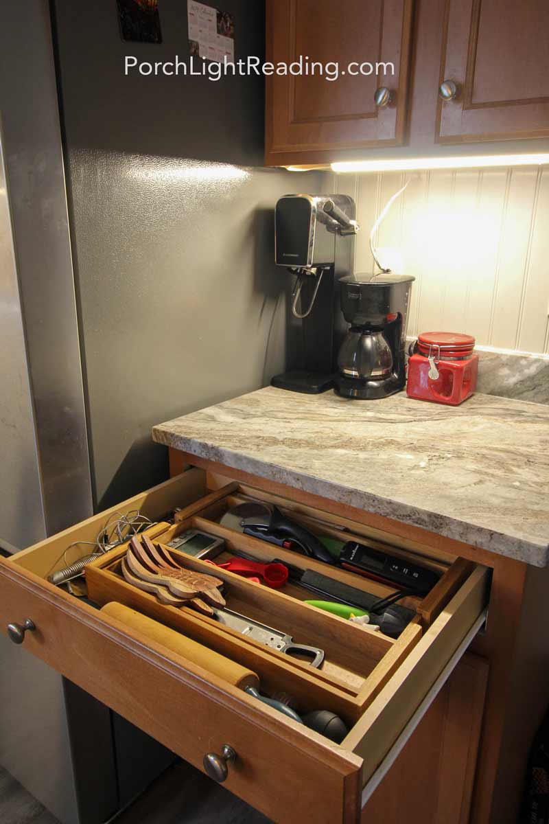Drawer organizers and clean countertop. 