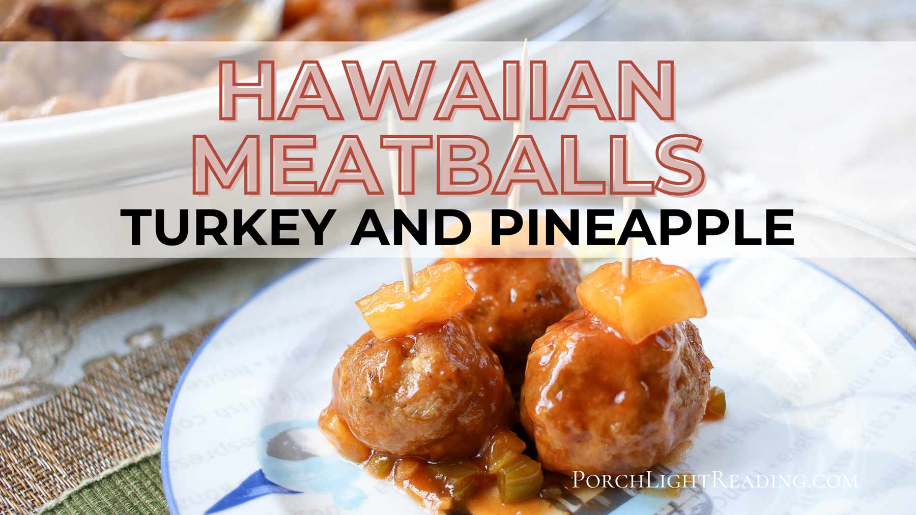 Hawaiian Meatballs served on a dinner plate with pineapple. 