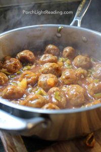 Hawaiian meatballs simmering in a pineapple sauce.
