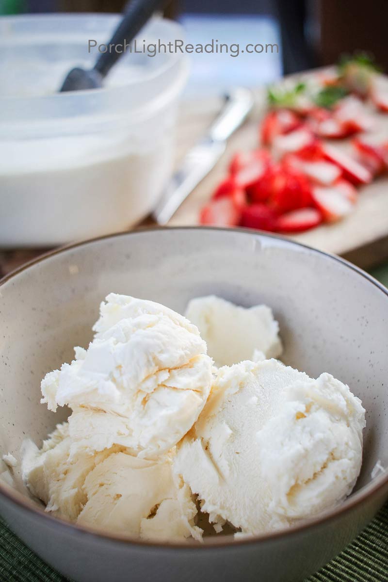 3 scoops of no churn vanilla ice cream in a tan colored bowl. 