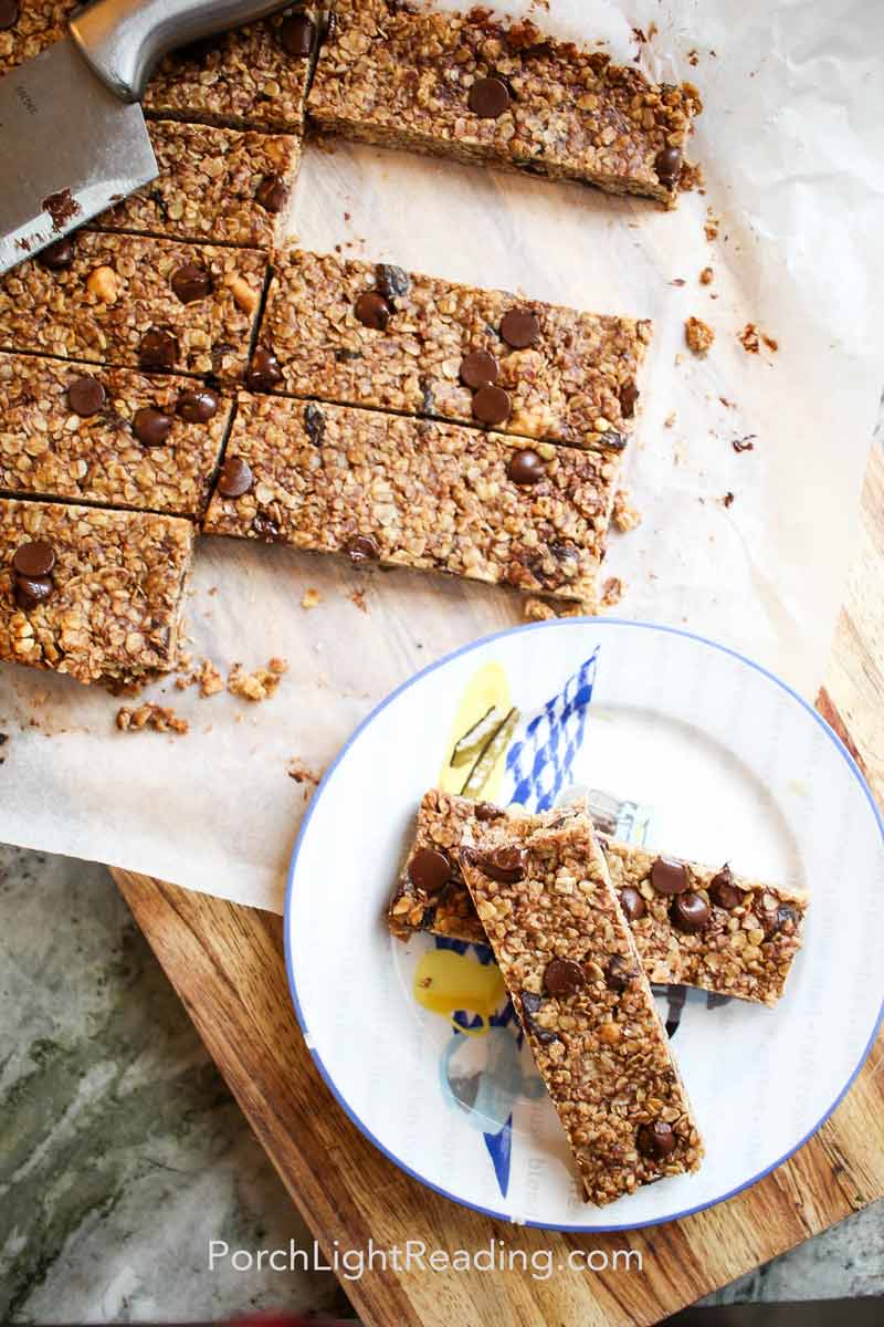 Sliced granola bars on a sheet of parchment paper. 
