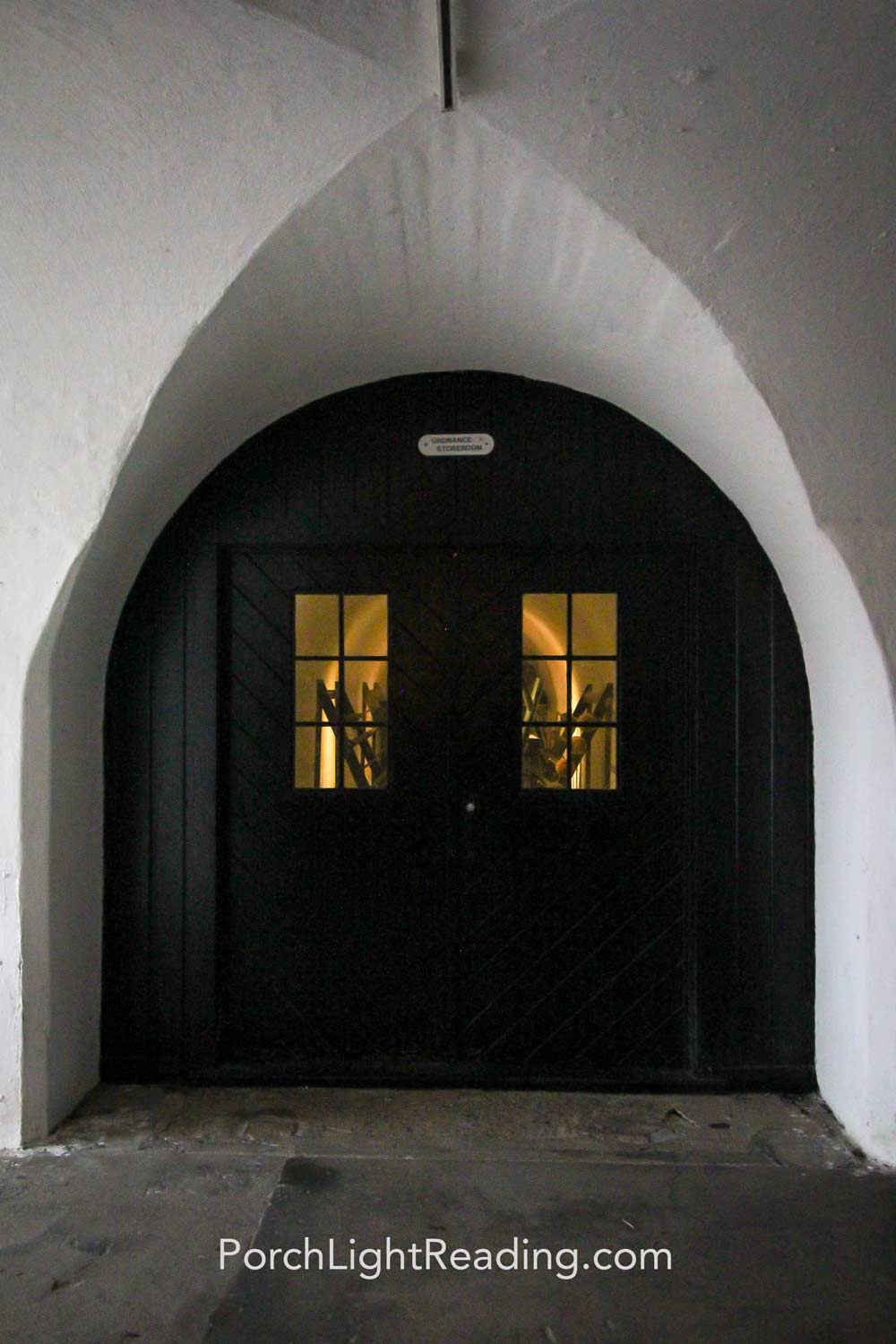 Black underground double door leading to stroage room.