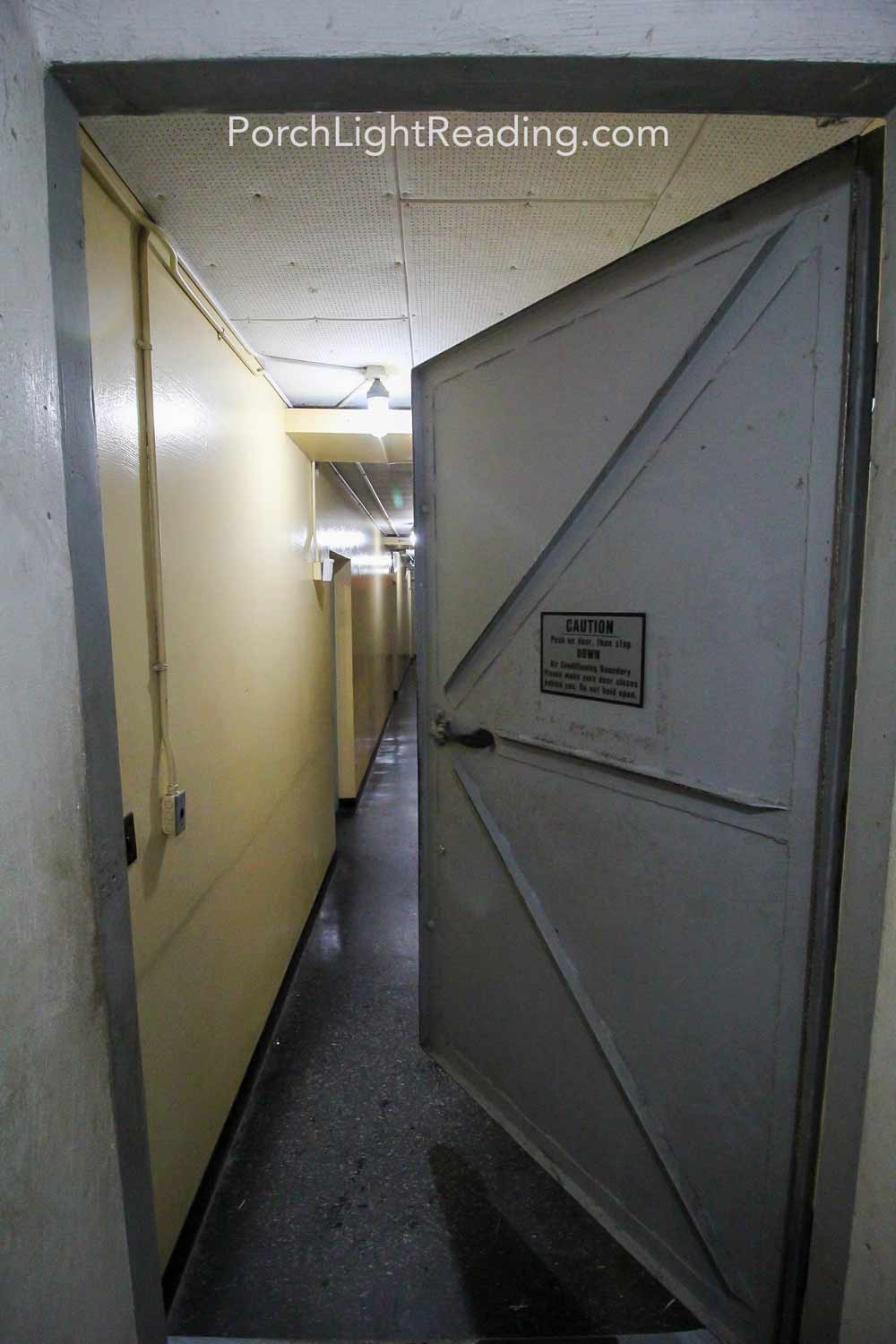 Underground bunker with heavy metal door.