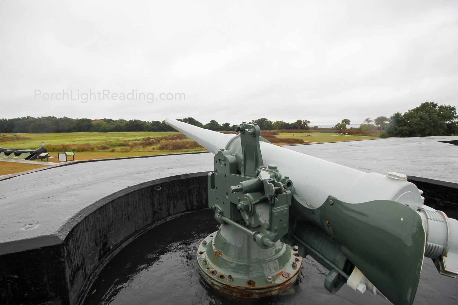 Decommissioned long range gun on fort rooftop.