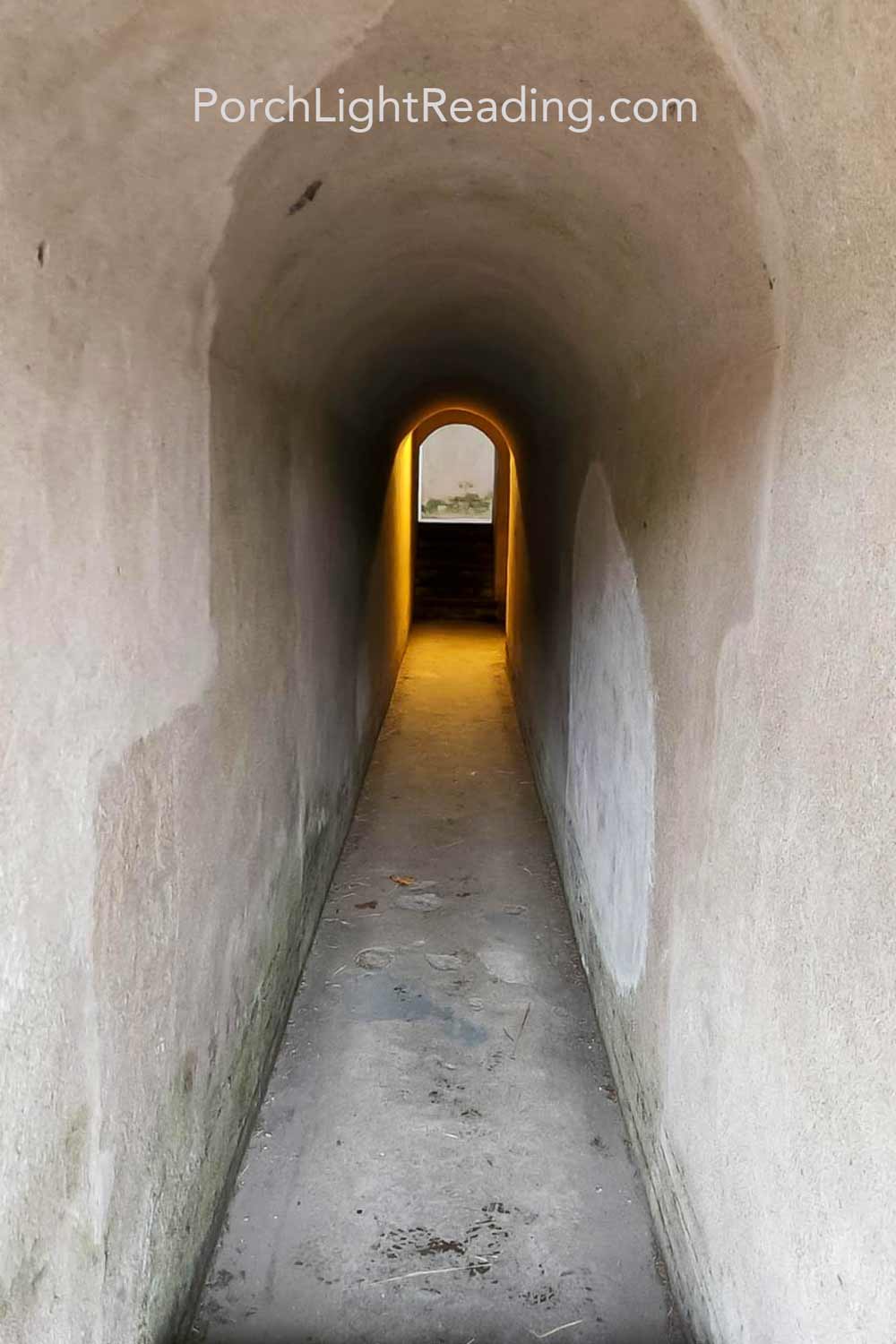 Small, long tunnel leading to different rooms in the fort.