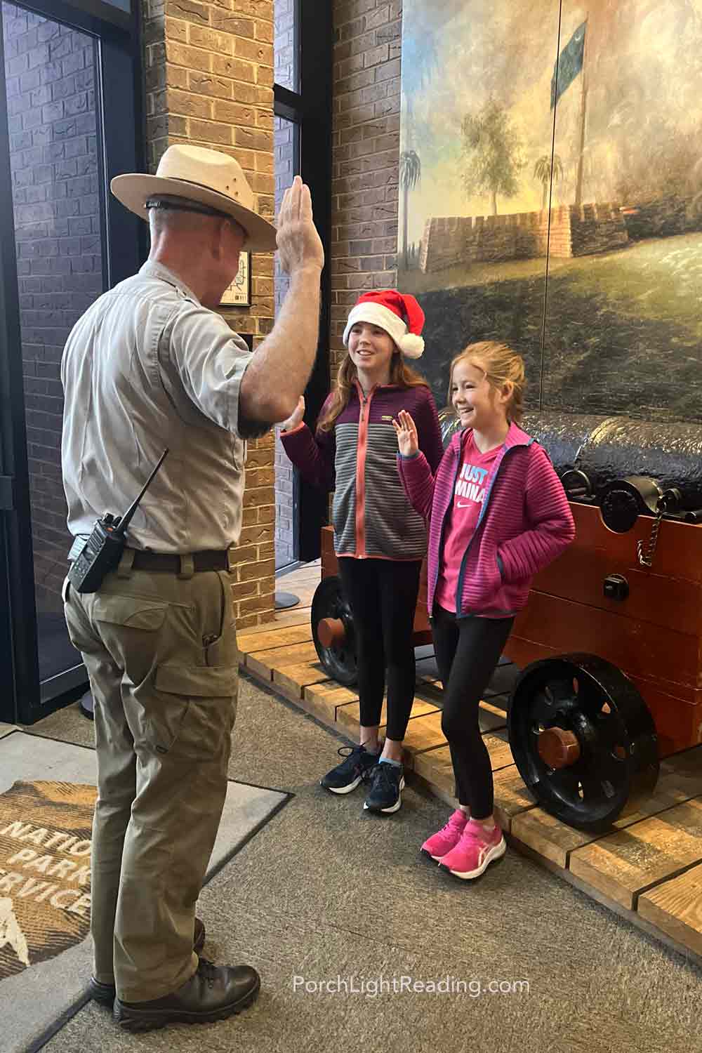 Two young kids becoming a Jr. Park Ranger.