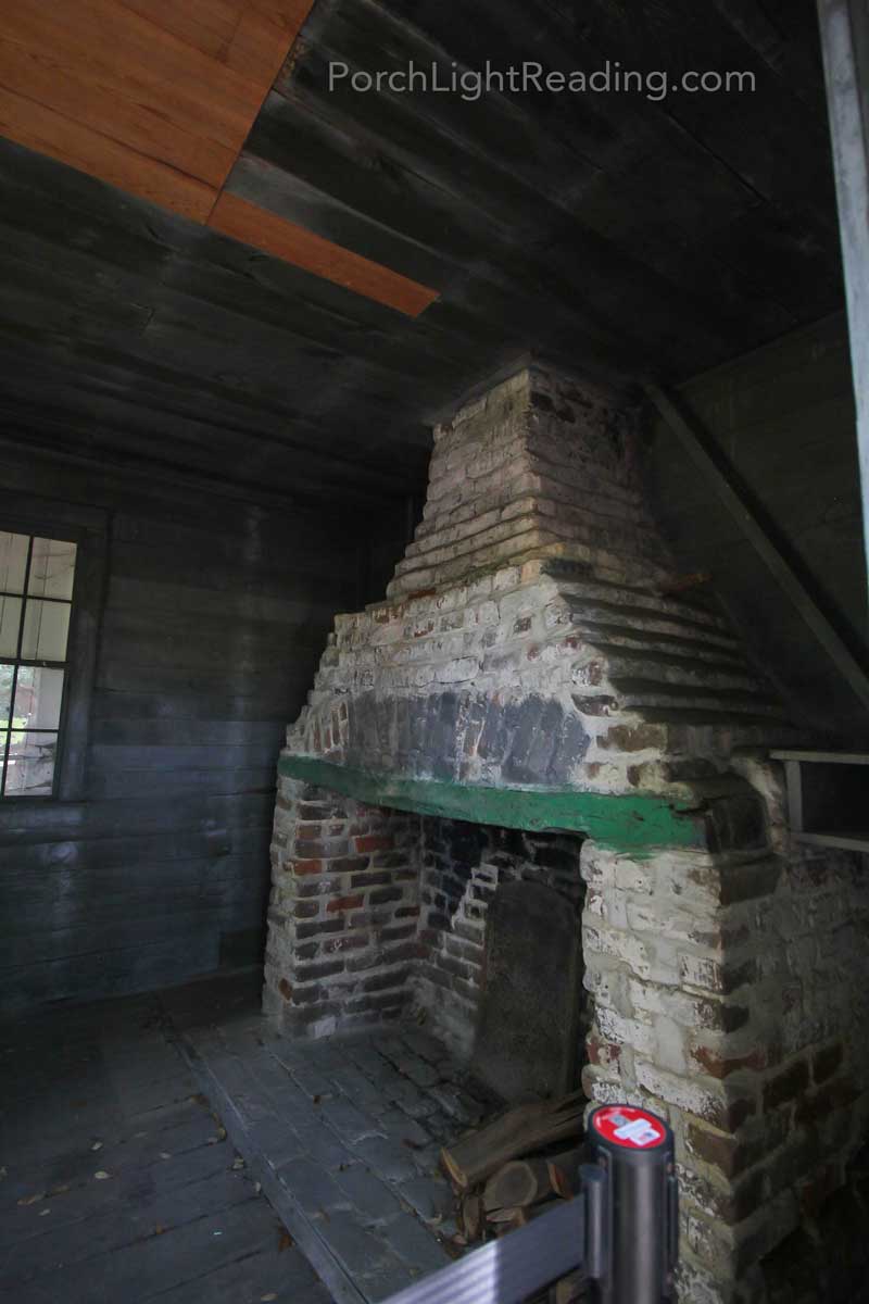 Eroding brick fireplace in the slave cabins.