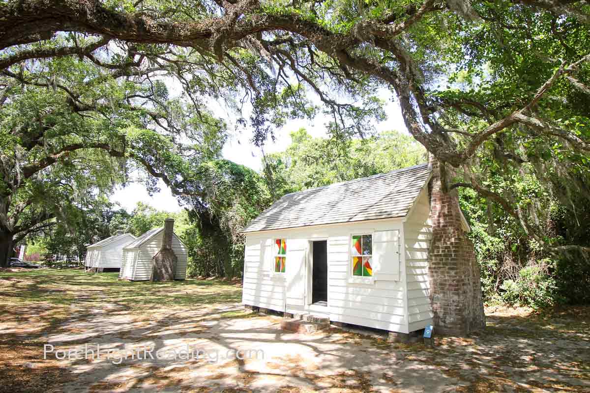 Small slave cabin with brick fireplace.