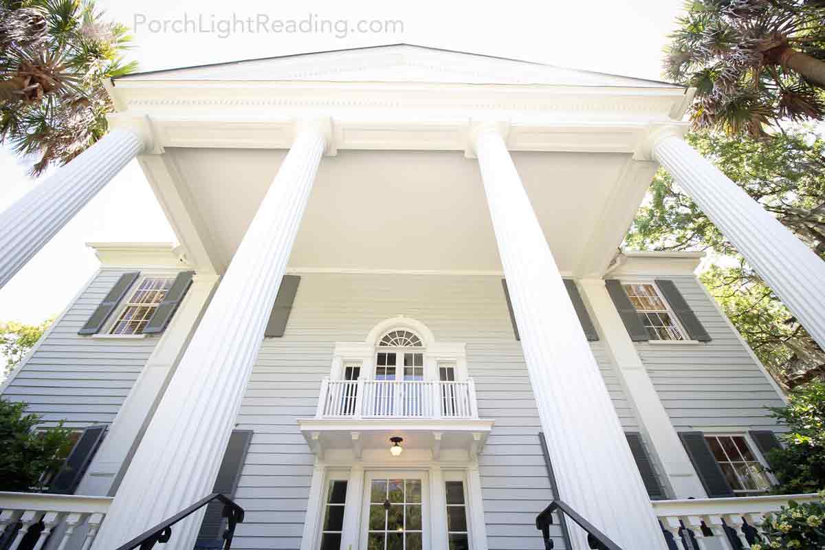 Plantation house with balcony and double doors.
