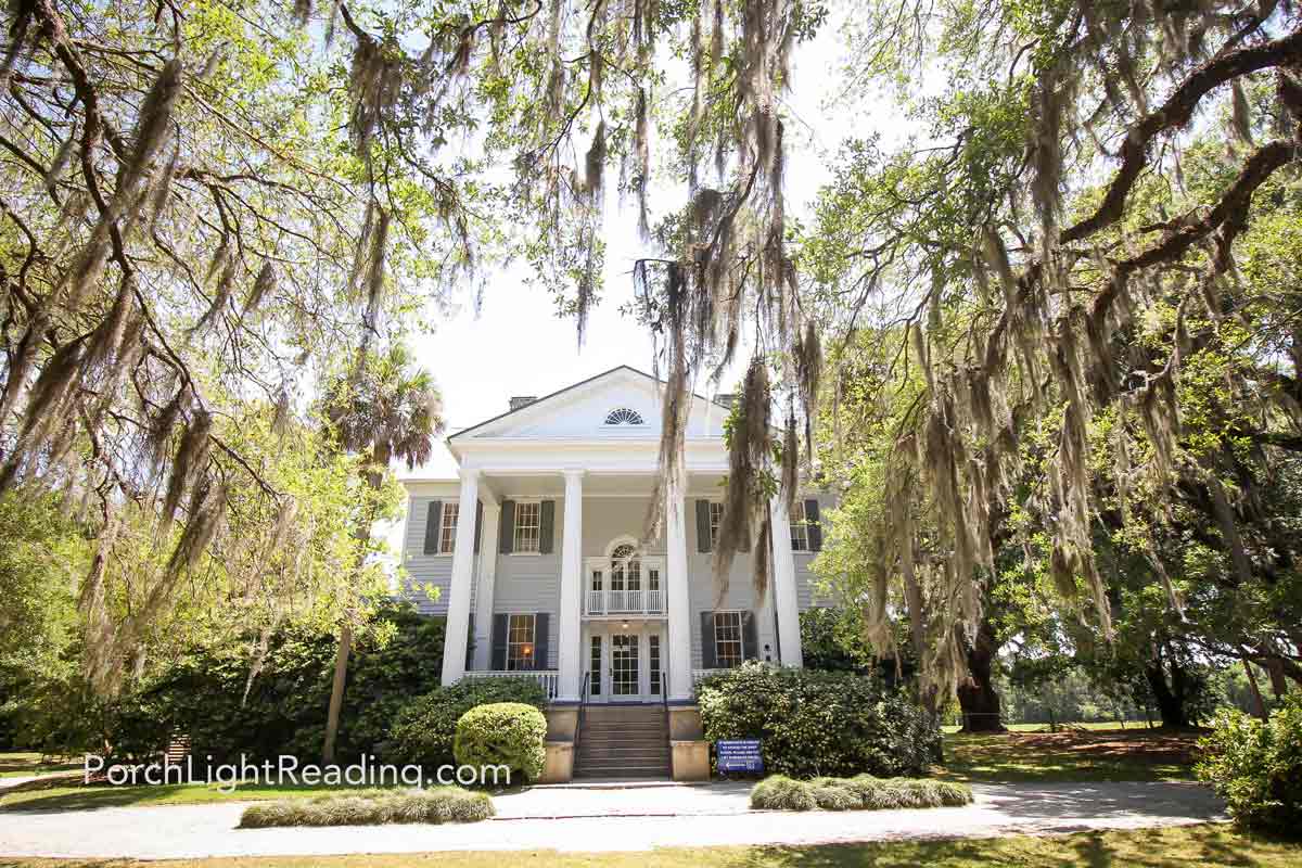 McLeod Plantation Historic Site house with palmetto trees and shrubs.
