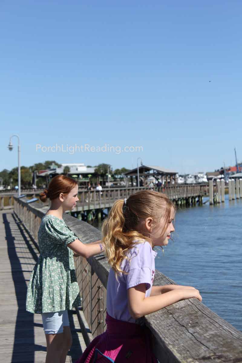 Kids walking along the boardwalks at Shem Creek. 