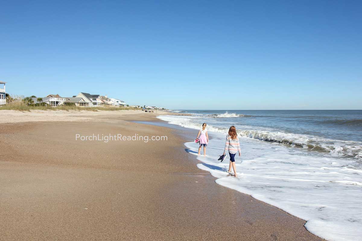 Two girls walking along the beach at Edisto Island South Carolina. 