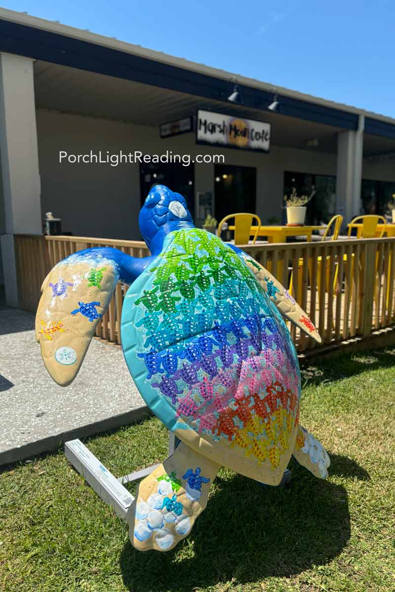 Painted turtle artwork outside the storefronts. 