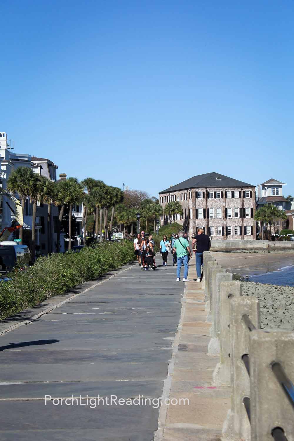 Families walking along The Battery. 