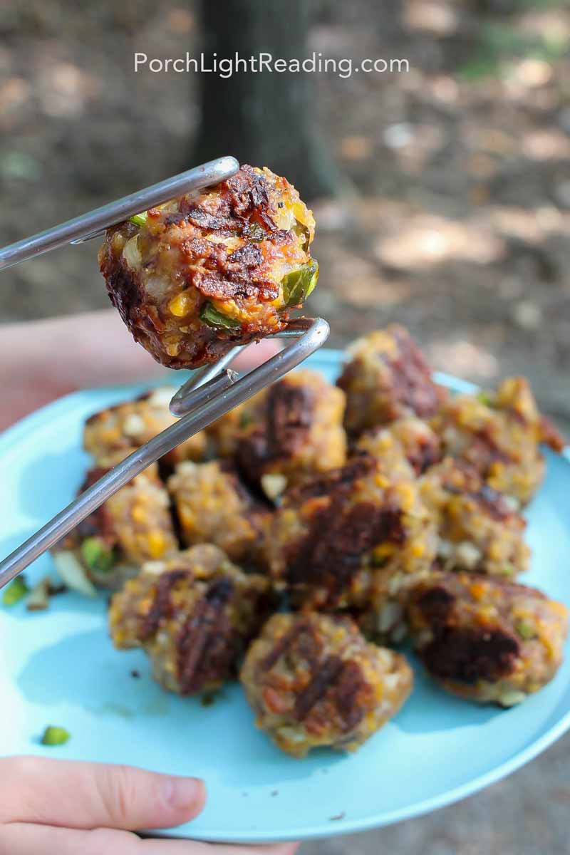 Camping breakfast sausage balls make over the campfire.