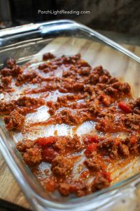 sauce spread on the bottom of a baking dish.