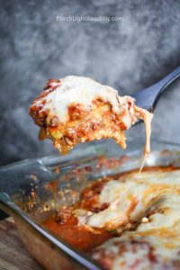 Zucchini lasagna on a spatula for serving.