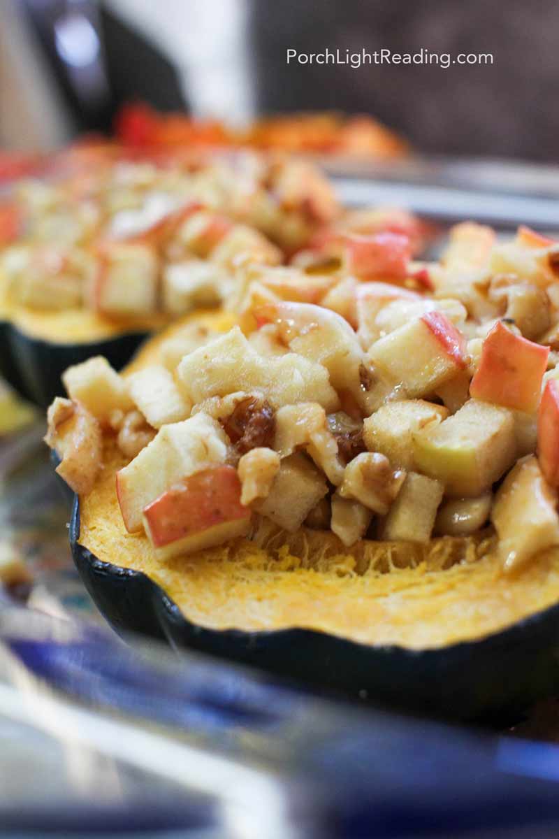 Baked acorn squash stuffed with apples and nuts. 