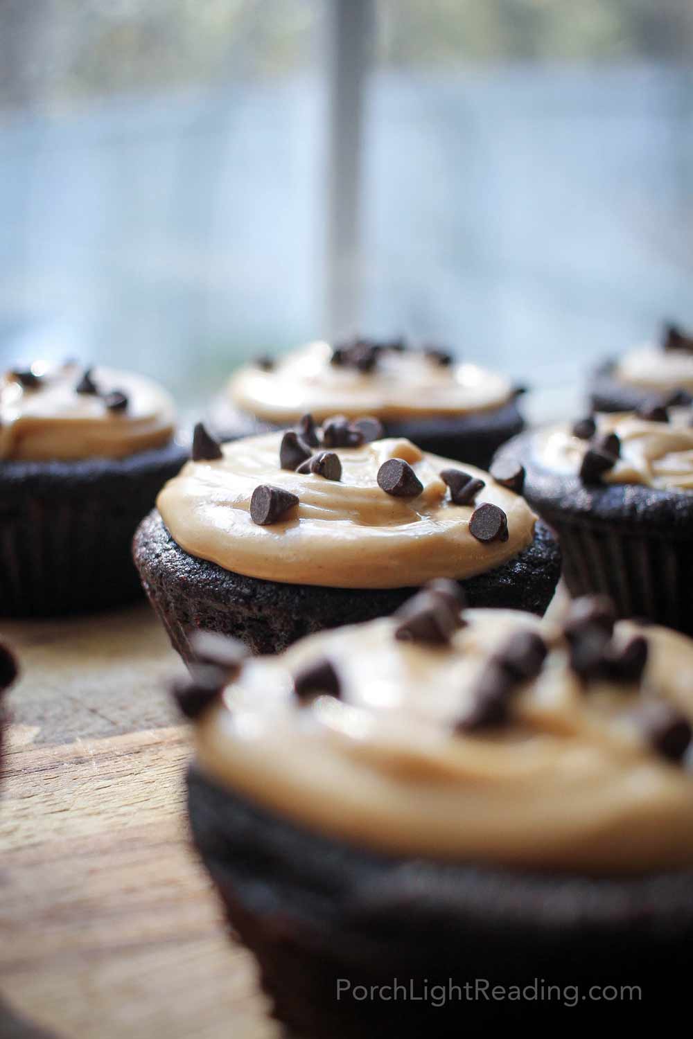 Kid friendly black bean cupcakes in front of a kitchen window. 