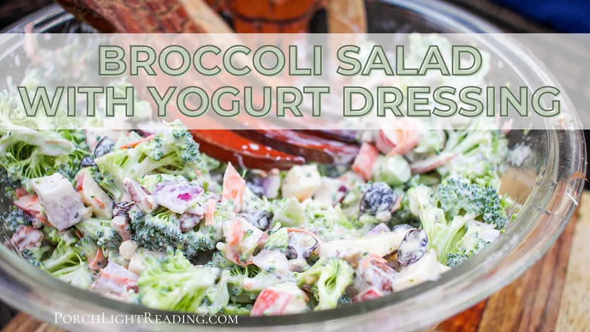 Broccoli salad in a glass serving bowl. 
