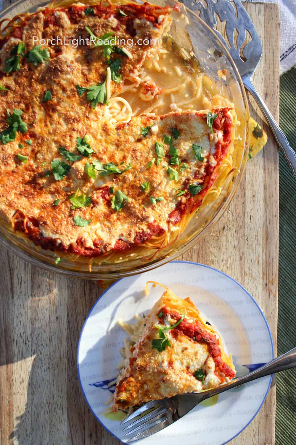 A slice of spaghetti pie taken out of the dish and served on a small plate.