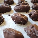 Date snickers filled with peanut butter and nuts and coated in chocolate.