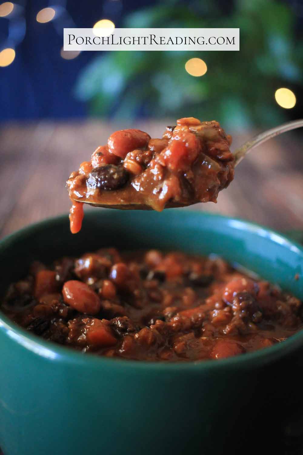 Vegetarian bean chili in a large green bowl. 