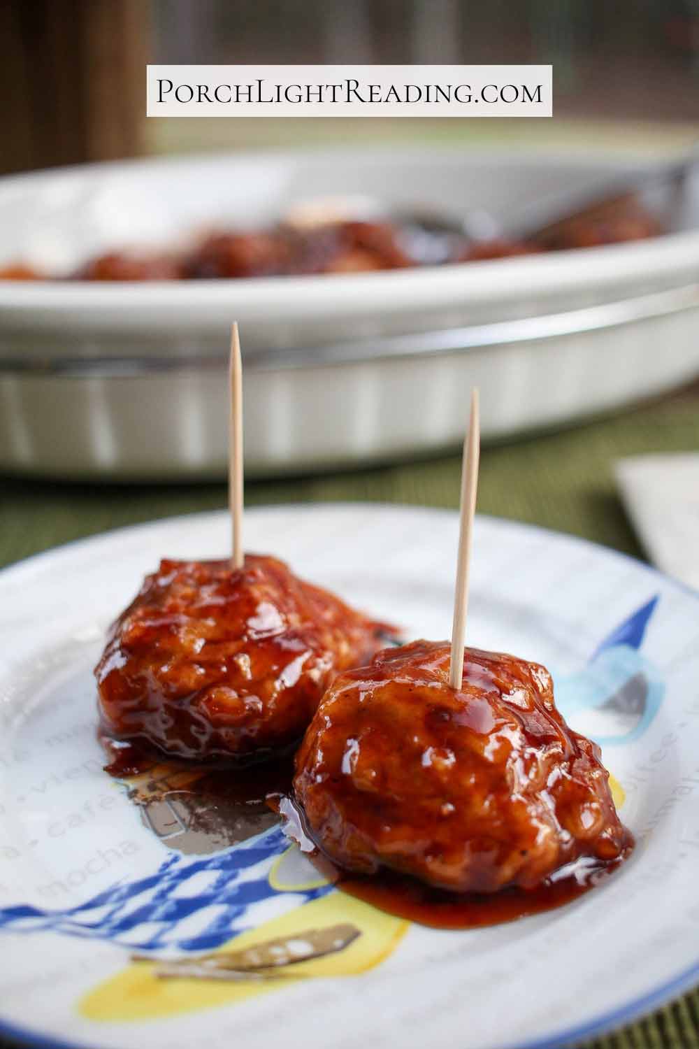 Vegetarian meatballs with a grape jelly sauce served with toothpicks. 
