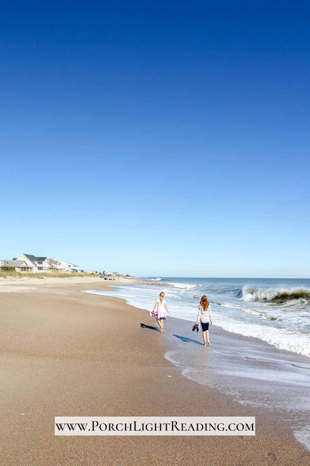 Two kids walking along the beach at Edisto, SC. 