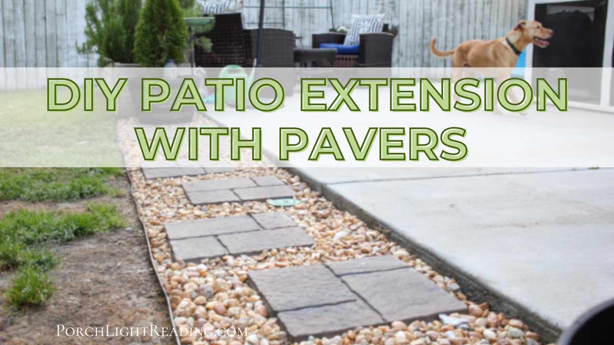 DIY patio extension showing pavers, rocks, and edging. 
