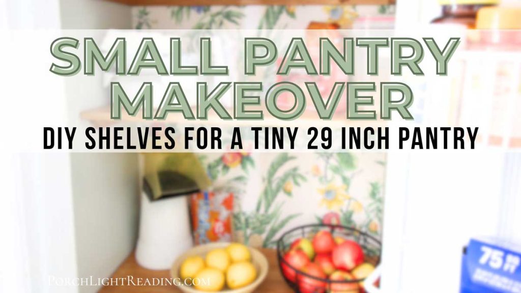 Small pantry with wooden shelves and wallpaper. 