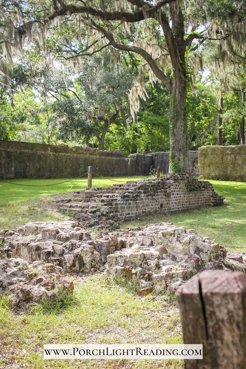 Fort ruins with surrounding wall. 