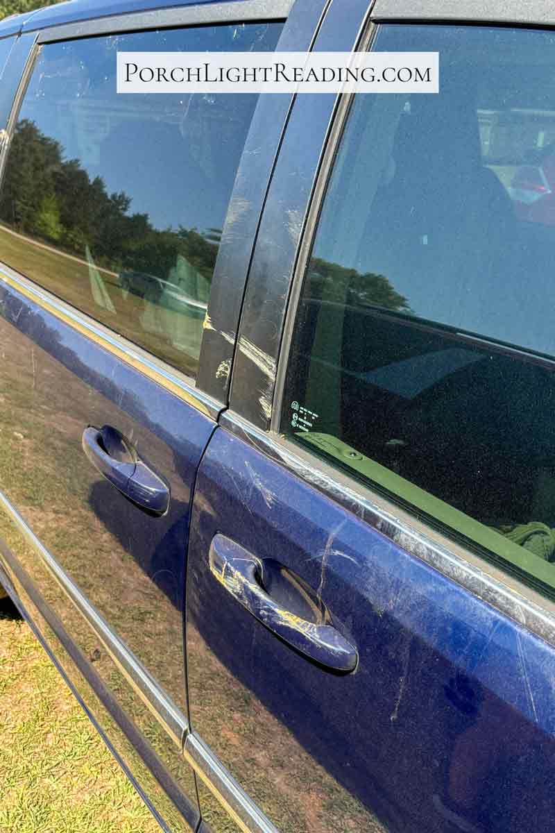 Dirty mini van after driving through the safari. With mud and slobber. 