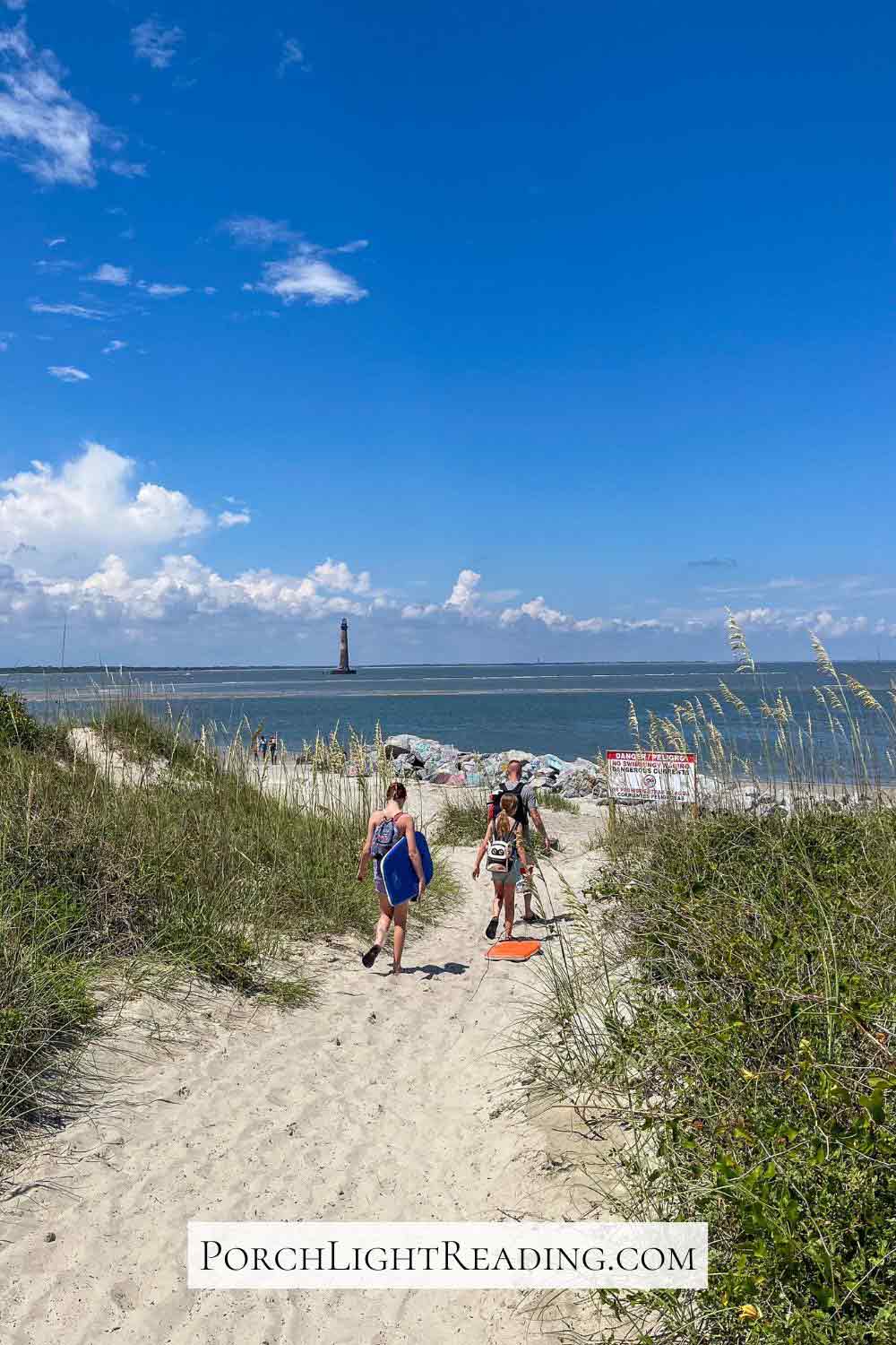 Family walking to the Morris Island Lighthouse, South Carolina. 