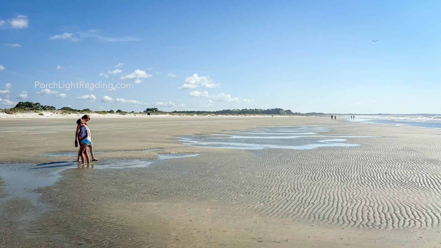 Kids splashing in a small tide pool along Charleston, SC, beaches. 