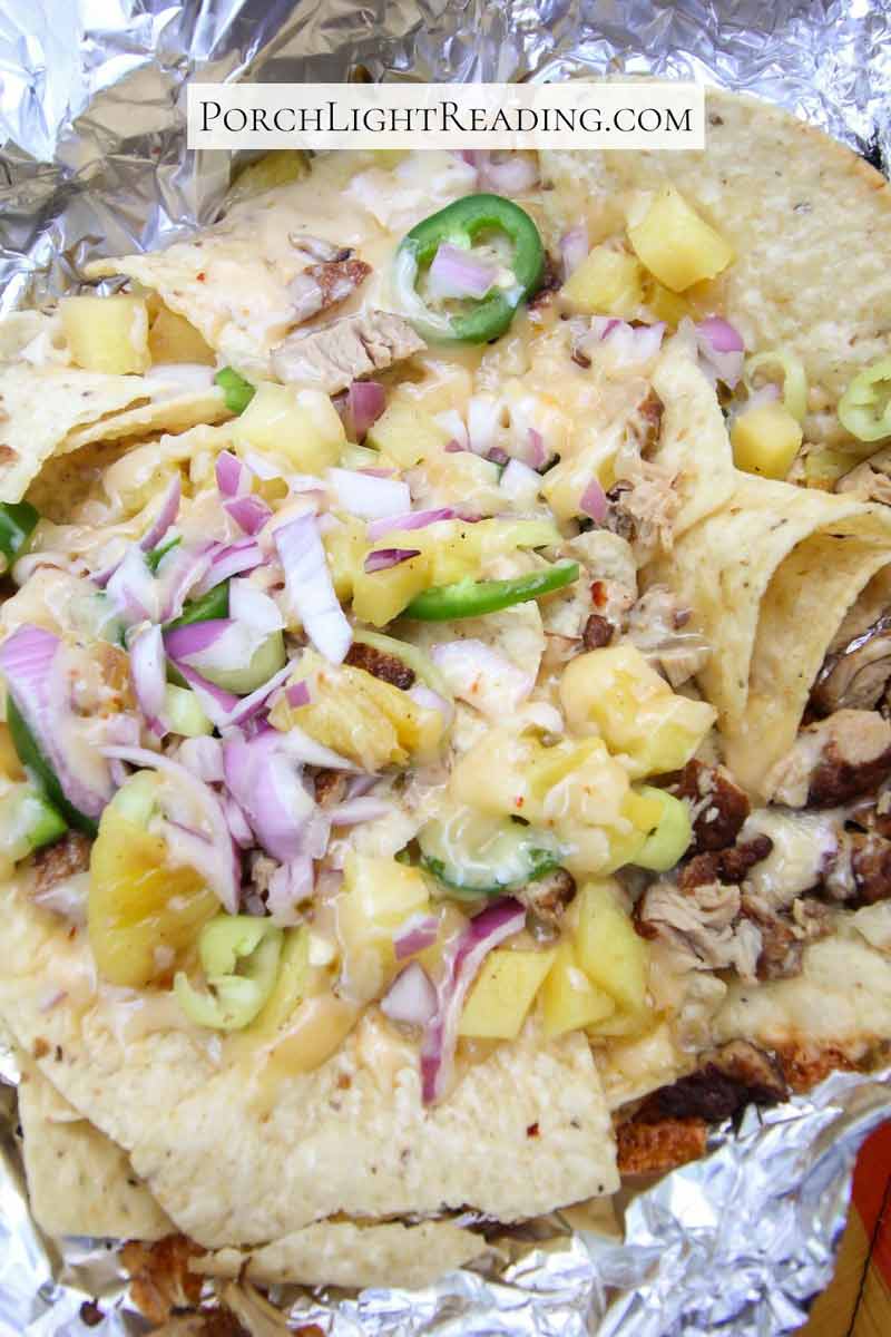 Campfire nachos topped with pulled pork. 