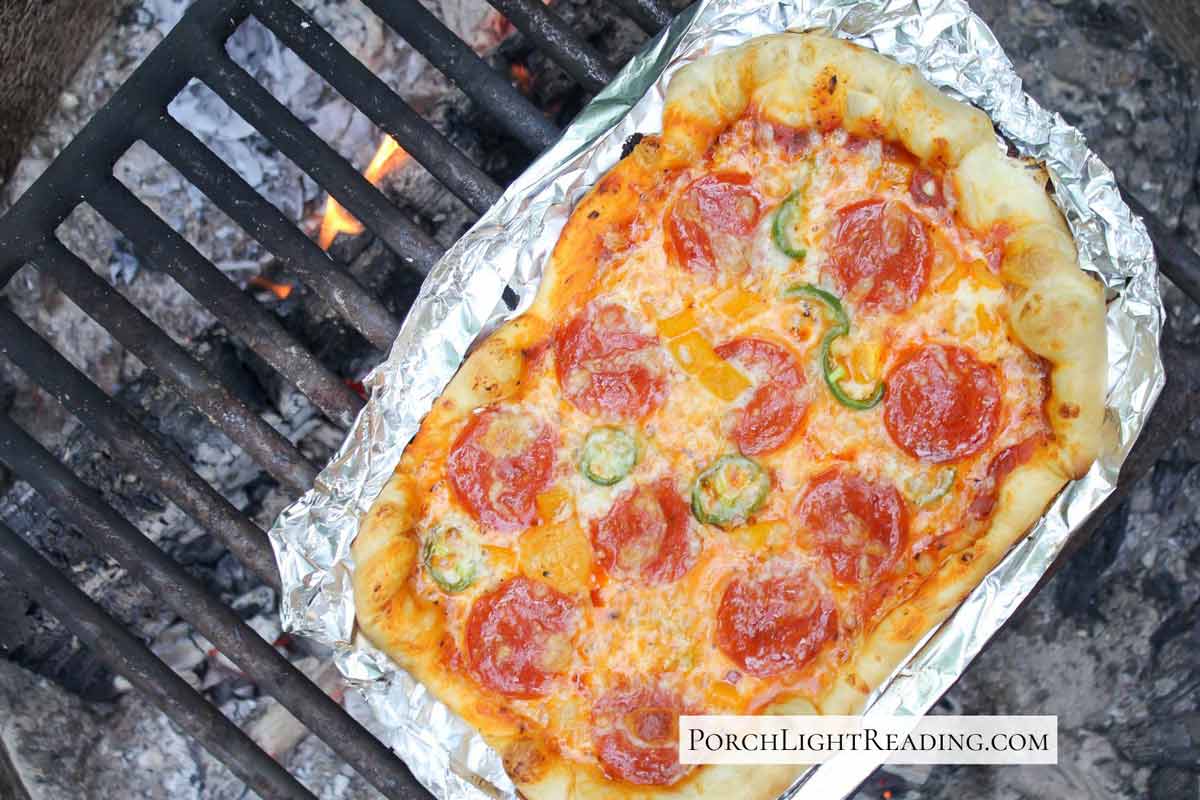 Pepperoni pizza make over the fire pit campfire. 