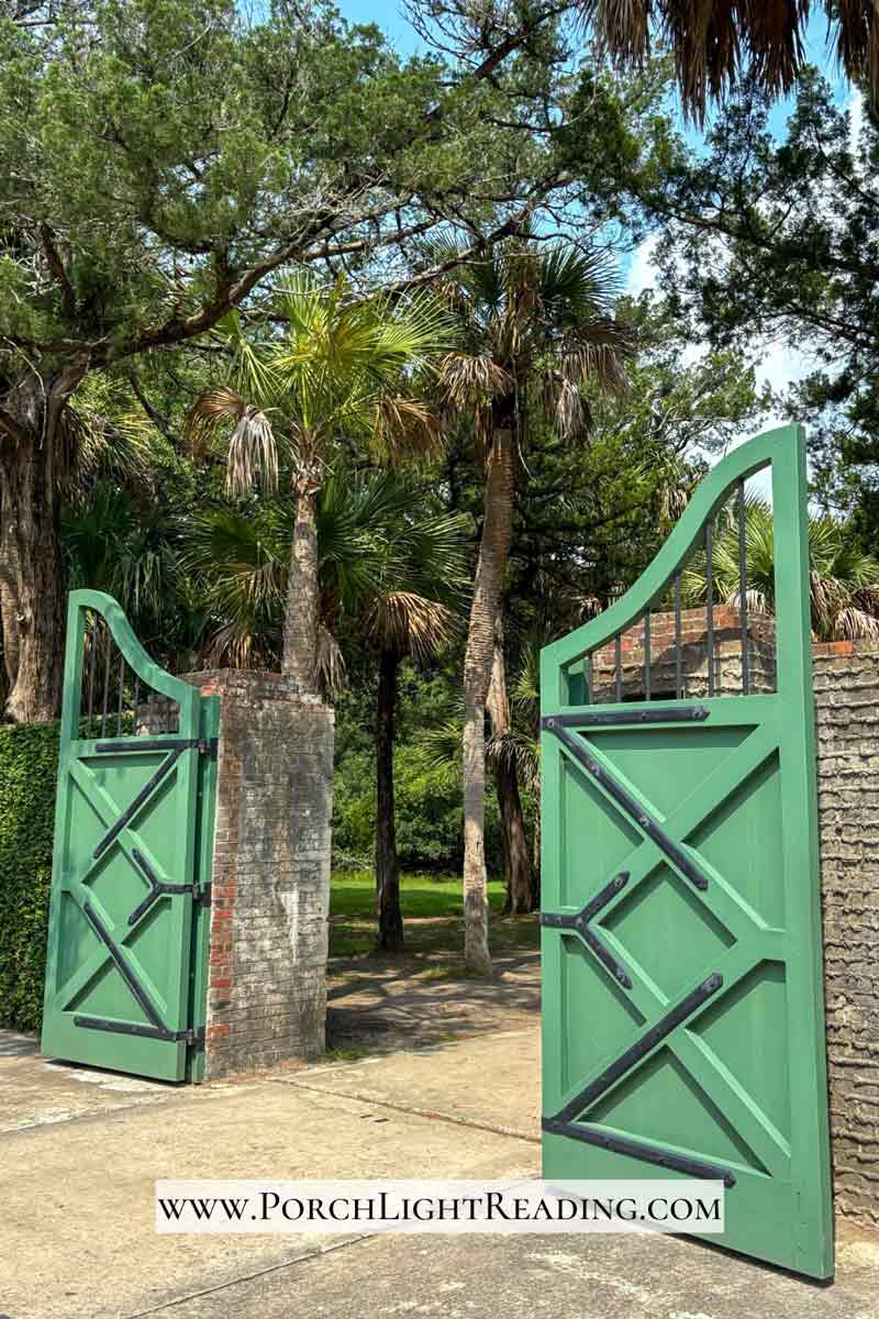 Large green gates leading from Atalaya Castle. 